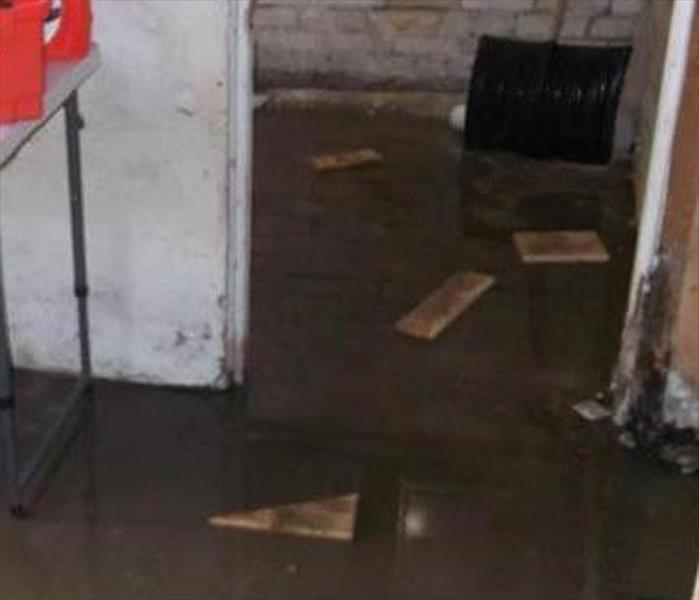 muddy water, basement floor, PVC pipe by drain