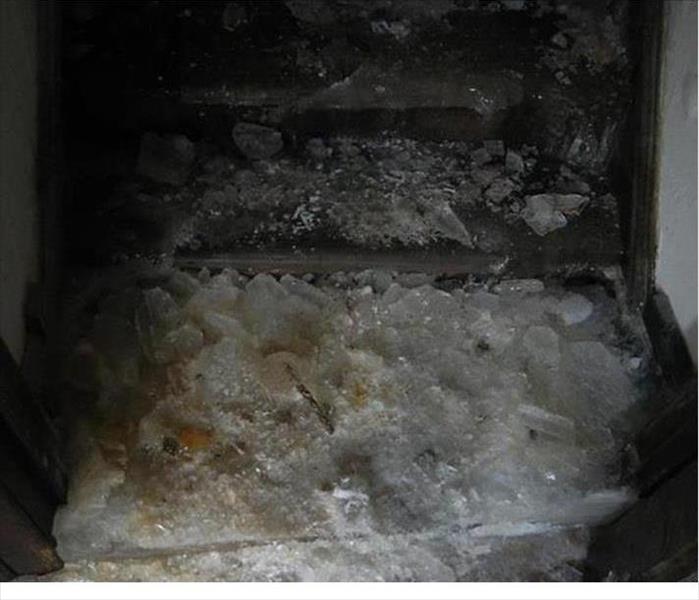 ice on steps leading to basement