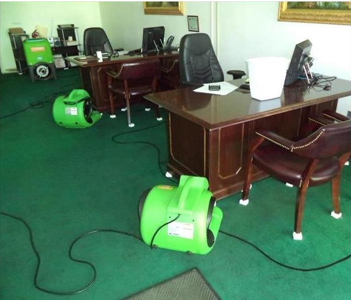 Green carpet, blocks under legs, air movers