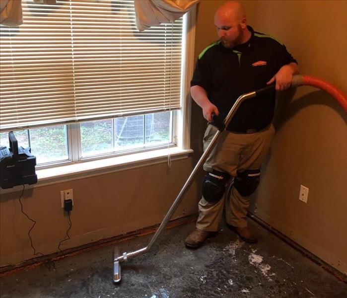 SERVPRO Tech extracting water