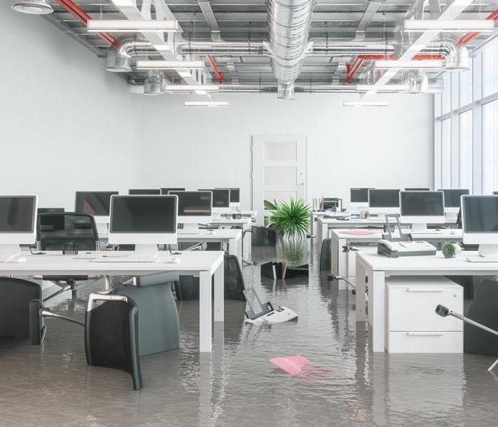 standing water in a building with table and chairs